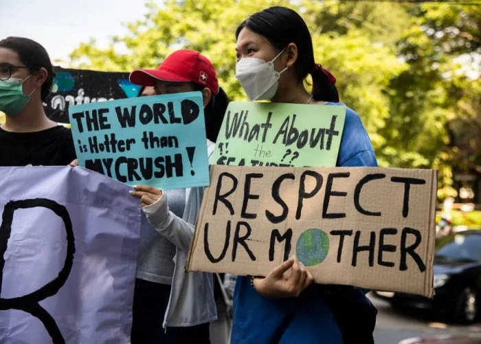 No Dia da Terra, ativistas climáticos protestam contra combustíveis fósseis